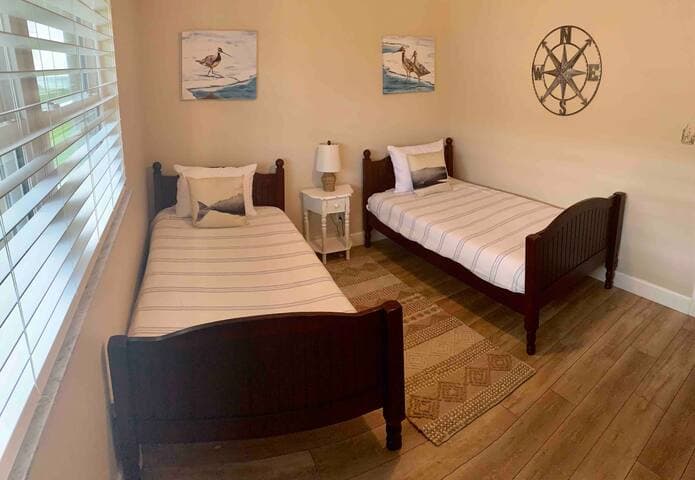 Guest room has twin beds with brand new Tuft&Needle mattresses for a good sleep after a day on the beach.