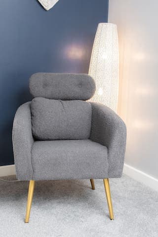 Deluxe mattress on a king size bed featuring a triple wardrobe, comfy chair and mood lighting.