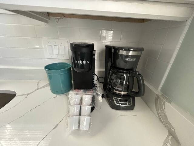 Keurig and drip coffee maker that includes some starter K-cups.