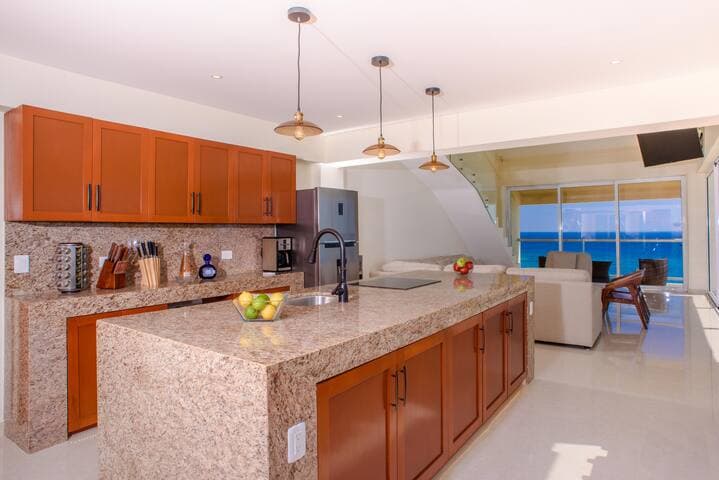 Open concept kitchen and living area to cook, dine and enjoy the views!