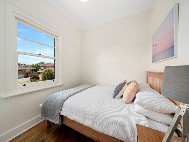 Bedroom 2 is smaller with a double bed and built-in wardrobe