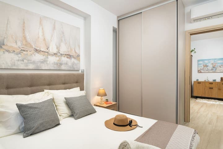 Bedroom with iron, iron board, and vacuum cleaner in case you need it.