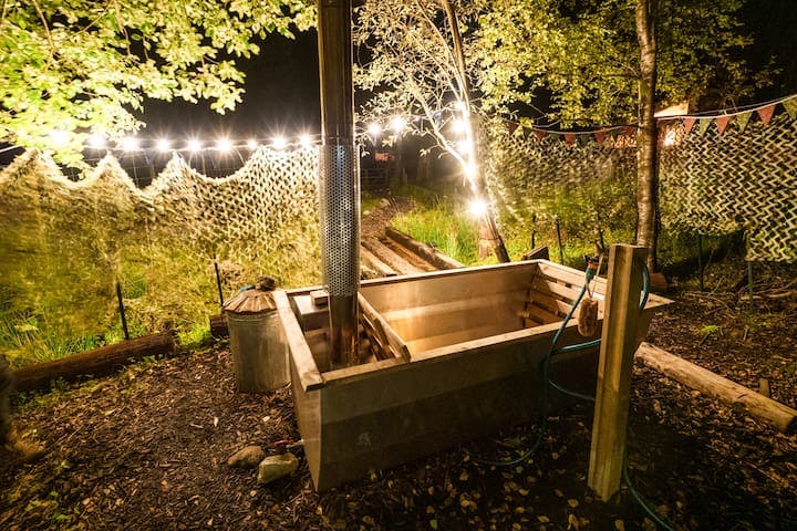Soak away those aches and pains in our shared outdoor wood-fired bath