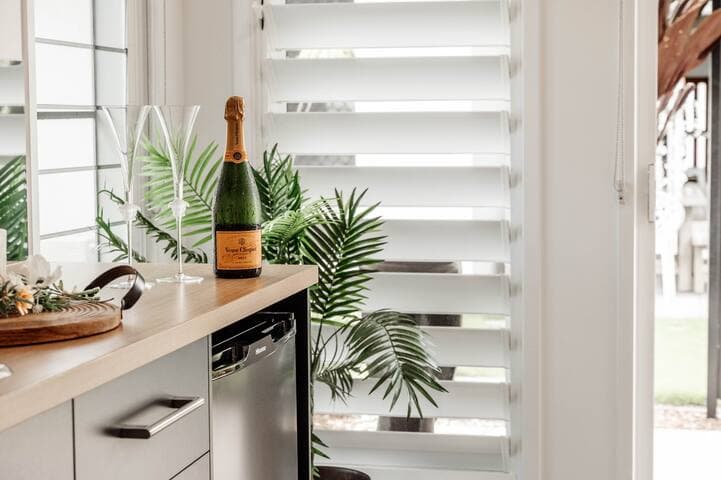 The master bedroom features it's own kitchenette along with ensuite and walking robe. Accessed by a covered walkway, this suite means that 2 families or 2 couples can enjoy complete privacy away from the main house.