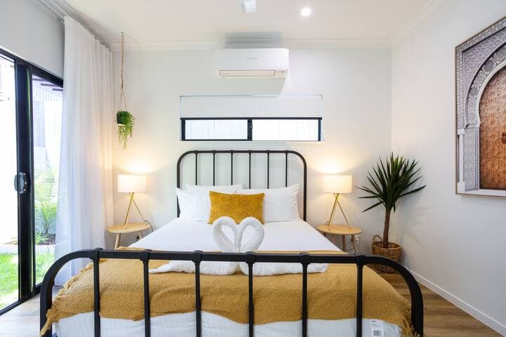 Comfortable Queen size bed in air conditioned room, with mirrored robe doors