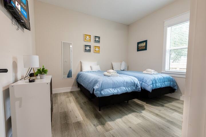 Bedroom 3: Two Twin beds with plush Sealy mattresses. A smart TV, large closet and a large ceiling fan with remote.  Nice large windows to bring in natural light. Conveniently located between bedroom 1 and 2. 