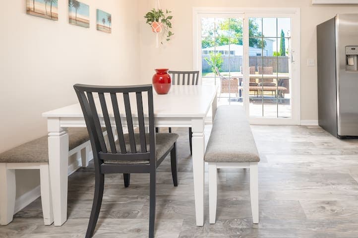 The cozy dining space seats 8 and offers an open concept to the living room. A great space to play some board games with friends and family.