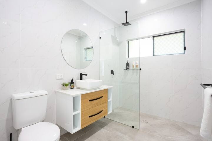 2nd bathroom with rain shower. We supply bathroom amenities including shampoo, conditioner, body wash there is even a hairdryer.