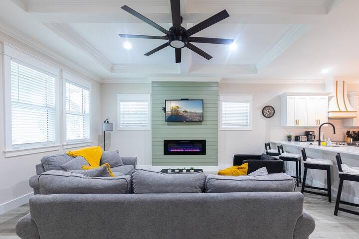 Unwind & relax in the large living room with a 50" smart TV, free Wi-Fi, & cozy couches. Enjoy the abundance of natural light, creating a perfect atmosphere for kicking up your feet and enjoying your favorite shows or movies relaxing with the family