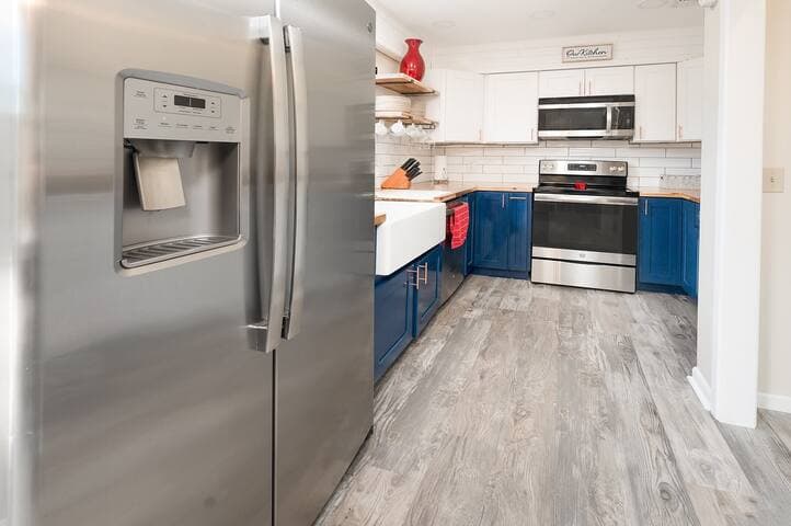 A newly renovated, fully equipped kitchen with plenty of natural light, high-end appliances, ample storage and a contemporary design.