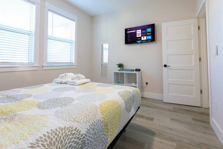 Bedroom 2: Indulge in comfort & relaxation in this queen-sized bedroom. Plush Sealy mattress on an electric adjustable base, soft sheets, plenty of pillows. Enjoy a smart TV, large closet, and a ceiling fan, all bathed in plenty of natural light.