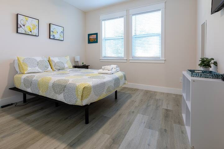 Bedroom 2: Embrace tranquility in this queen bedroom. Plush mattress, ample natural light, spacious closet. Enjoy privacy with window coverings and a remote-controlled ceiling fan. 
