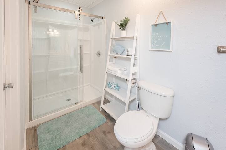 Newly renovated full bath with double vanity sinks attached to the master bedroom on the first floor.