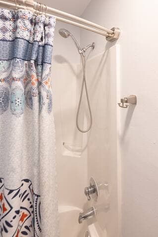 The upstairs full bath has a removable shower head with great water pressure and a stainless steel, double curved, shower rod.