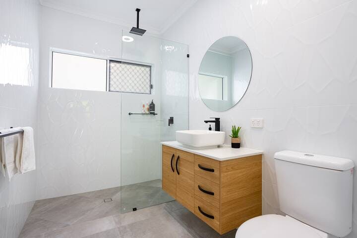 You will love this stunning light-filled bathroom with an awesome rain shower feature. We also supply Shampoo, Conditioner and Body Wash. You'll even find a Hairdryer.