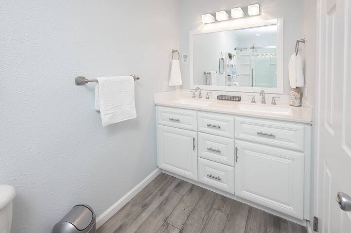 The first-floor bathroom offers a vacation-vibe with plenty of space to get ready with shampoo and conditioner provided.