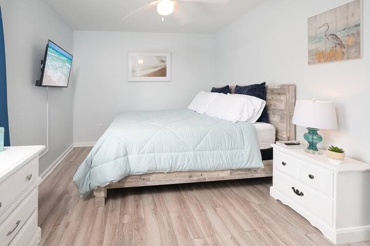 The 3rd upstairs bedroom offers privacy and plenty of natural light, an Amazon Fire TV, dressers and a spacious closet.