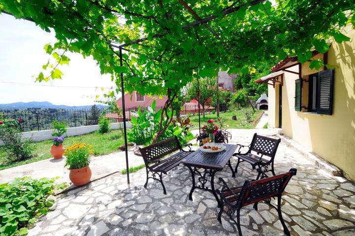 Perched at the top of the hill, make the most of this spacious, private garden area overlooking the cascading green hills of Corfu's north west coast