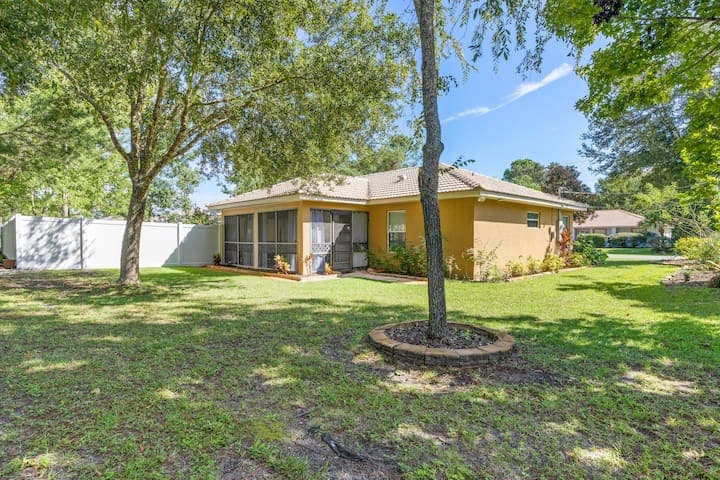 View from the back corner of the yard looking at the back of the house.