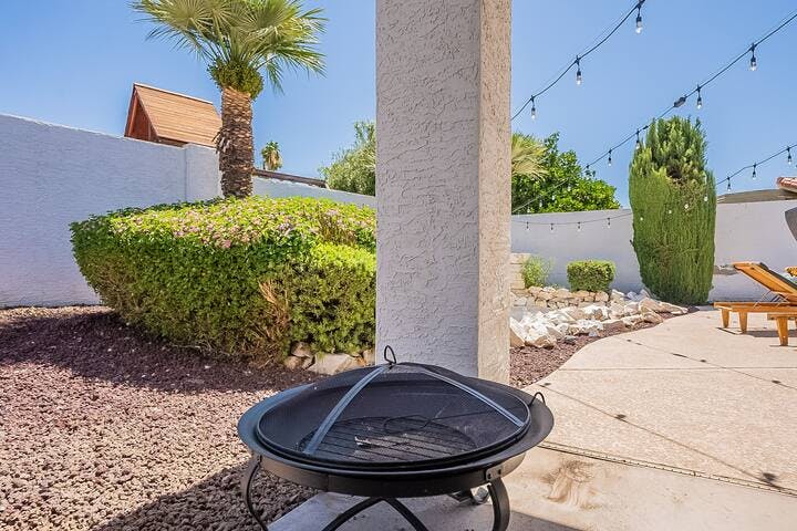 Embrace the cozy ambiance of this backyard fire pit, where unforgettable moments are kindled.