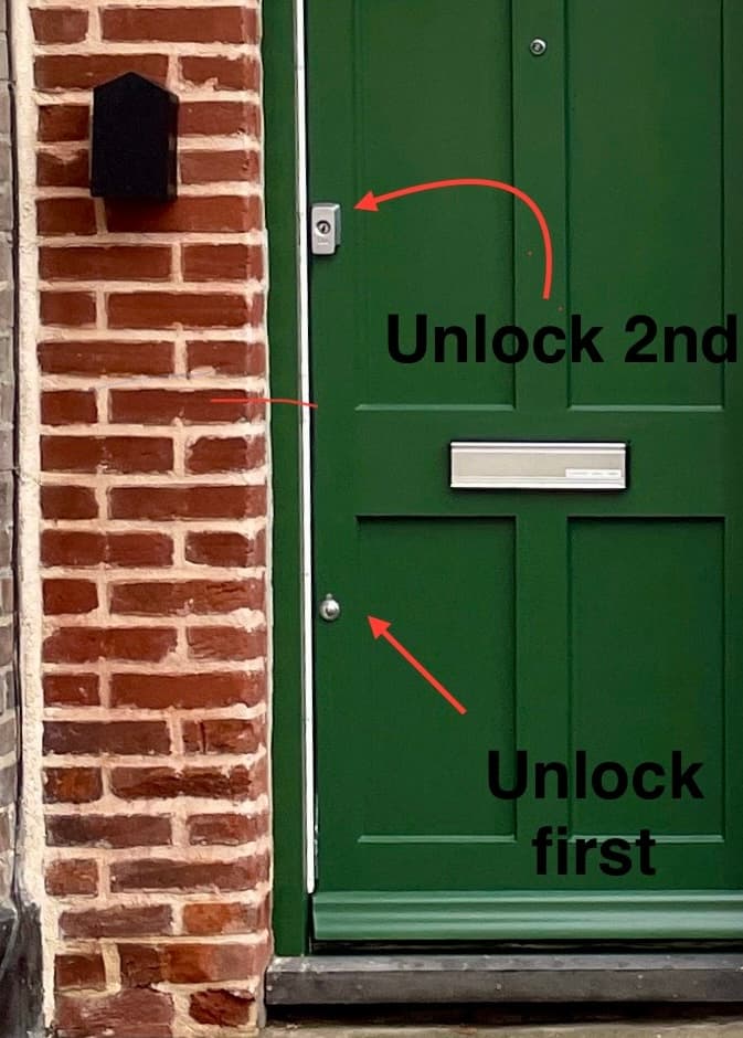 Two keys for Two locks. 1 - Use the long key to unlock the round bottom lock first. 2 - Then the top lock with the short key to open the door.