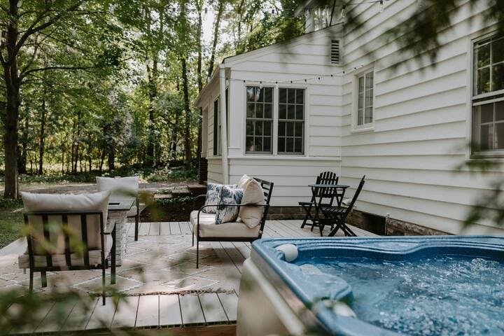 Enjoy our hot tub & patio seating in our hidden 1 acre in the woods.