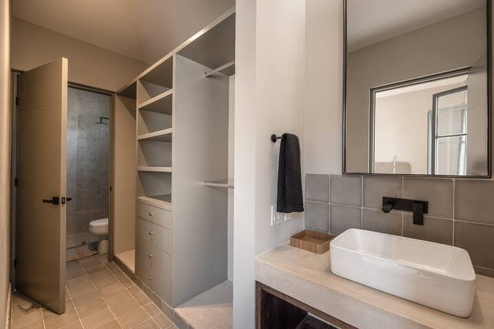 Bathrooms feature built in closets with private shower and toilet