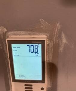 Living Room | Heated Floor Thermostat This thermostat controls the heated floors in the living room. 100°F is a great setting to keep the space cozy and comfortable in colder months. It is powered off during the summer months, but it still works.