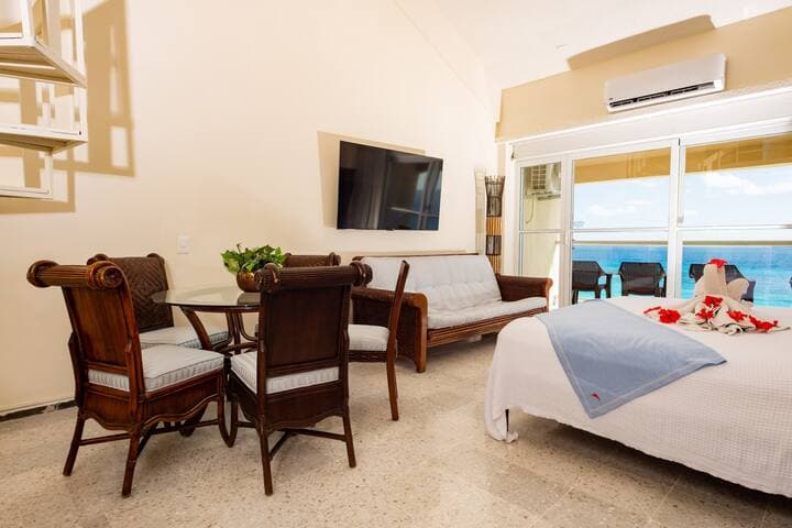 Dining area downstairs. Seating for 5 at the table and two at the bar.