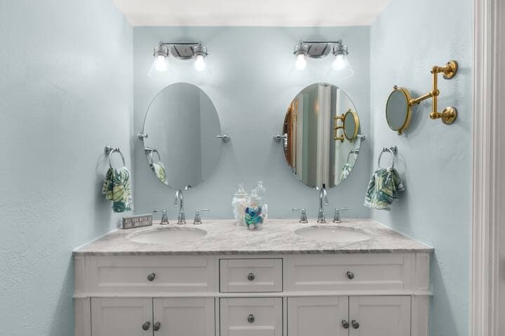 Primary bathroom has double sink, water closet and large shower.