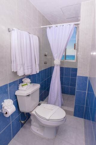 Bathroom connected to second bedroom with a view of the ocean from the shower!