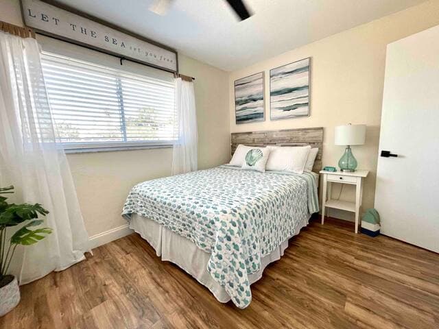 Second bedroom features a queen bed and smart TV.