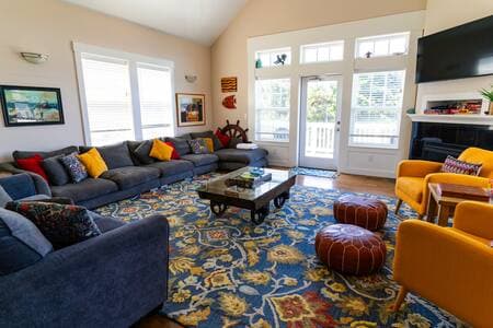 Living room with fireplace and tons of seating for a large group