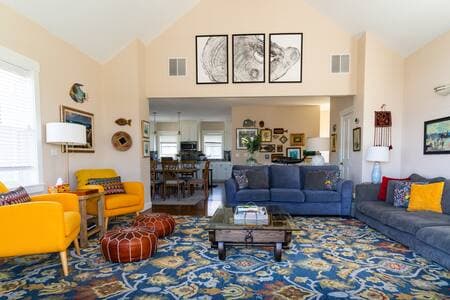 The living room, dining room, and kitchen are all on the very open and light upper floor of the house. The views make it a lovely space to spend time together.
