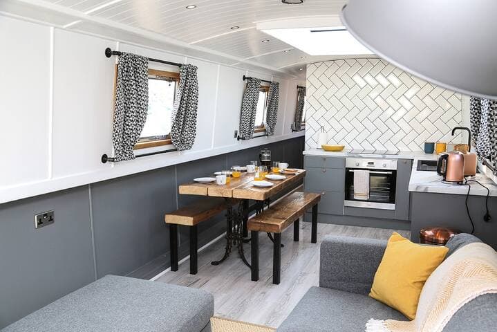 Living area and kitchen on the Liverpool Boat. The boat sleeps 6 and is moored in Liverpool Marina.