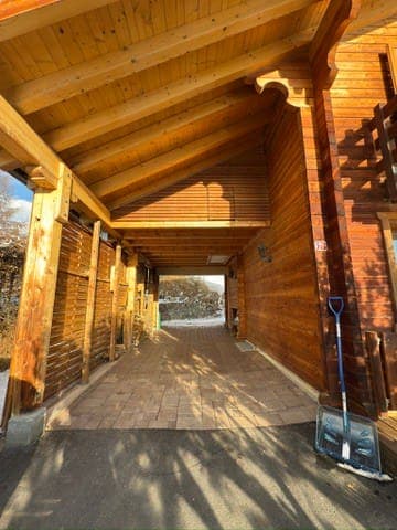 Space to park 2-3 cars, partially roofed.