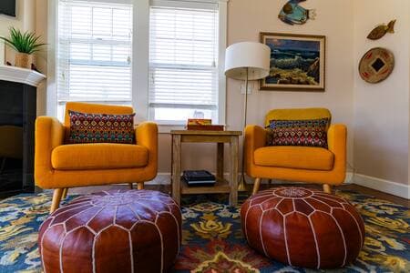Living room with fireplace and tons of seating for a large group